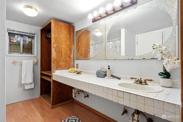 bathroom with vanity and wood-type flooring