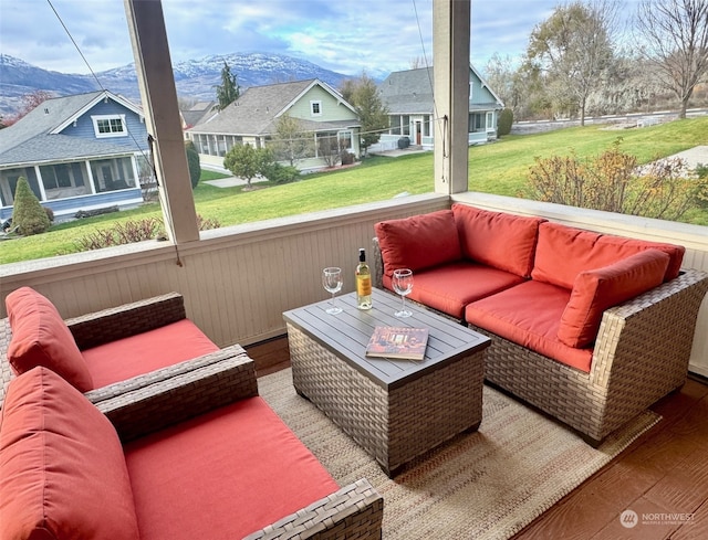 sunroom featuring a mountain view