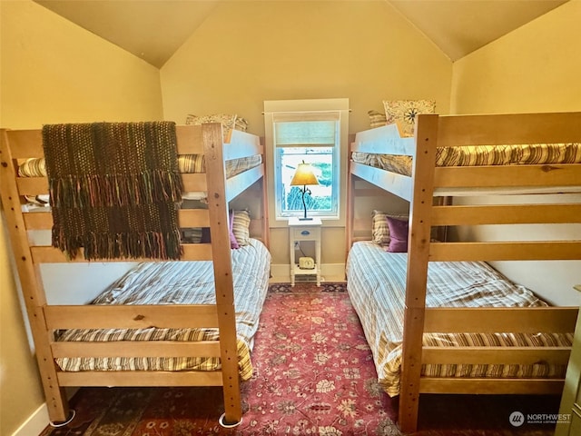 bedroom featuring lofted ceiling