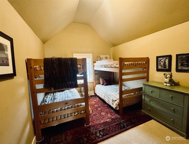 carpeted bedroom featuring vaulted ceiling