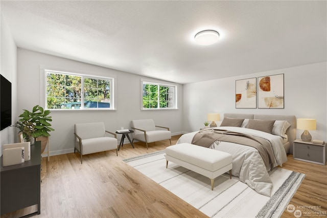 bedroom featuring wood-type flooring