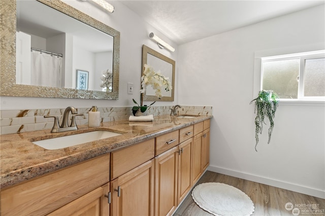 bathroom with wood-type flooring and vanity