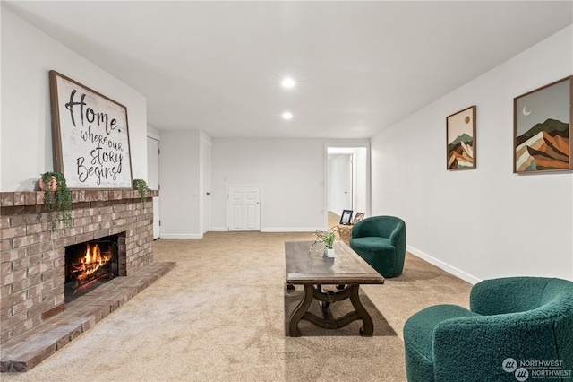 carpeted living room featuring a fireplace