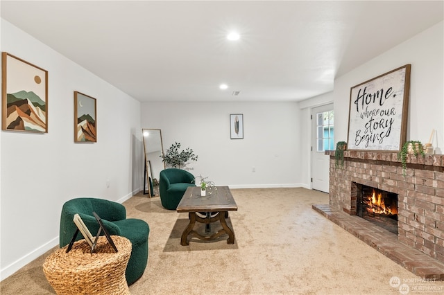 carpeted living room with a fireplace