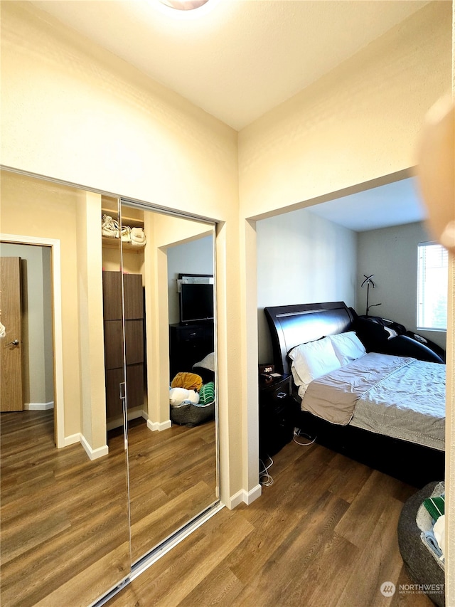 unfurnished bedroom with hardwood / wood-style floors and a closet