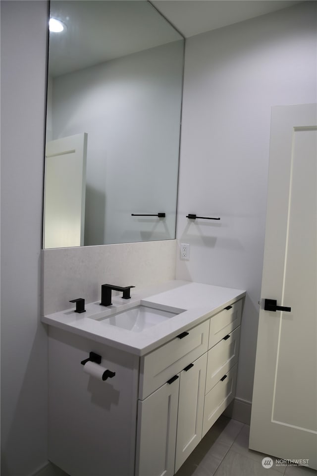 bathroom featuring vanity and tile patterned flooring