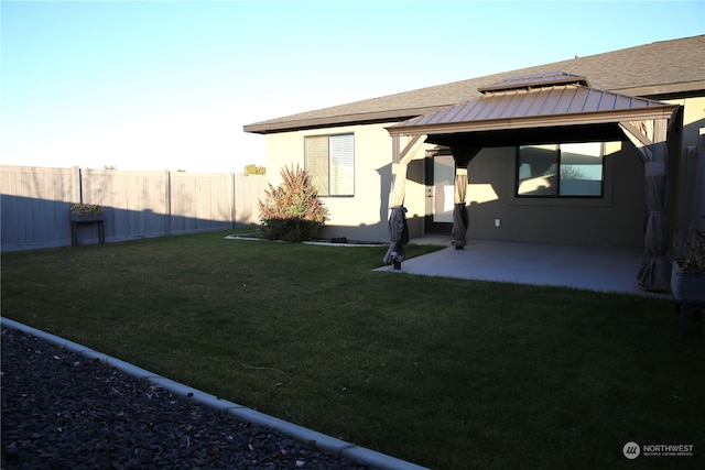 view of yard featuring a gazebo and a patio