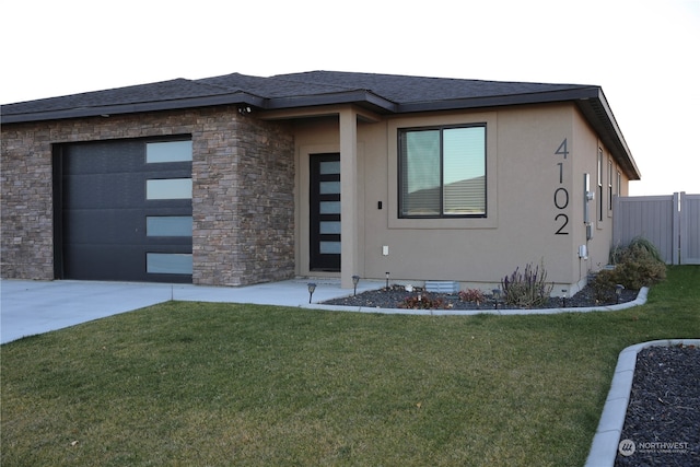 prairie-style house with a front lawn