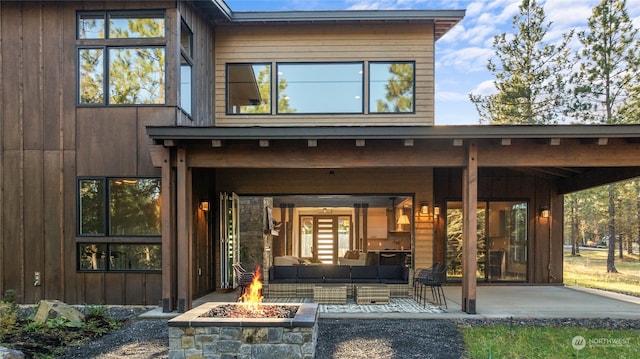 entrance to property with an outdoor living space and a patio