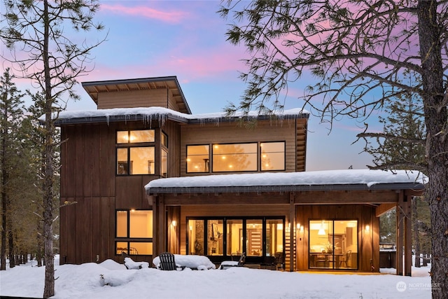 view of snow covered house