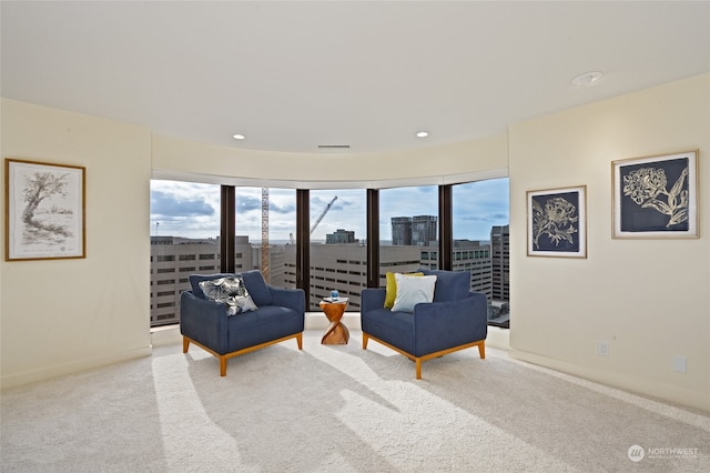 living room with a healthy amount of sunlight and light carpet