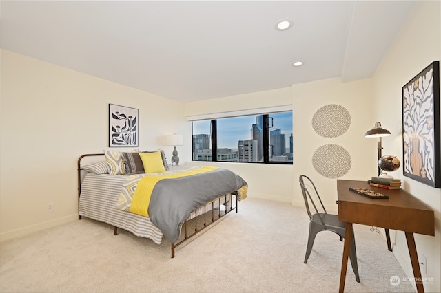 bedroom featuring light carpet