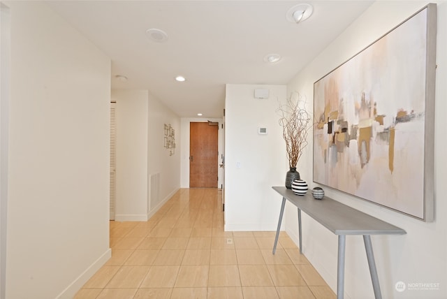 hallway with light tile patterned floors