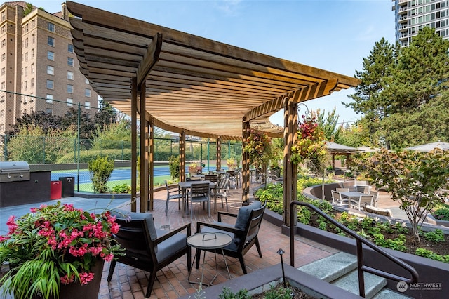 view of patio with a grill and a pergola