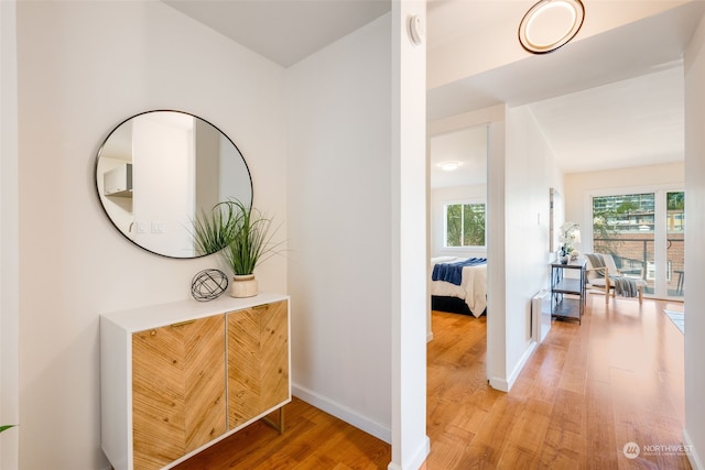 corridor featuring hardwood / wood-style floors