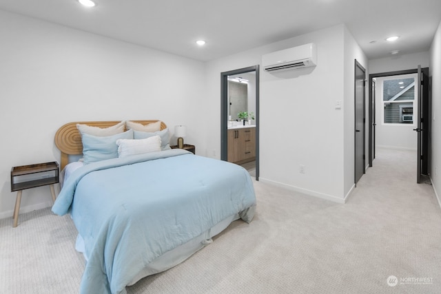 carpeted bedroom with ensuite bathroom and a wall unit AC