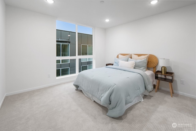 bedroom with light colored carpet