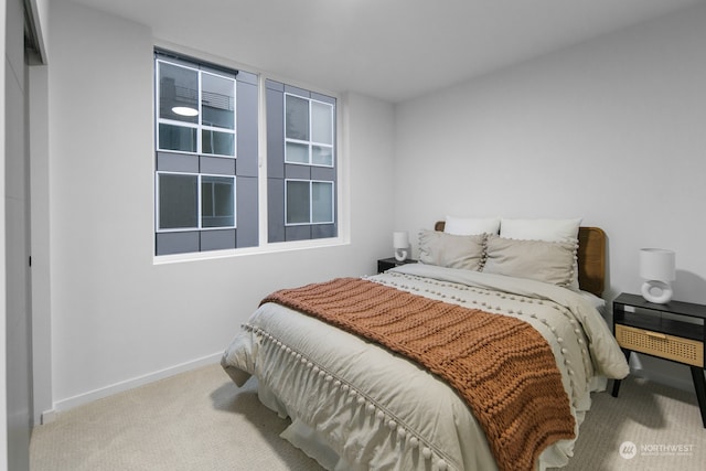 bedroom featuring light colored carpet