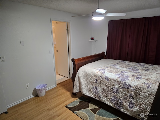 bedroom with ceiling fan and wood-type flooring