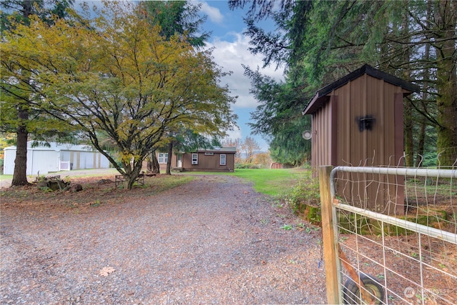 exterior space with a storage shed