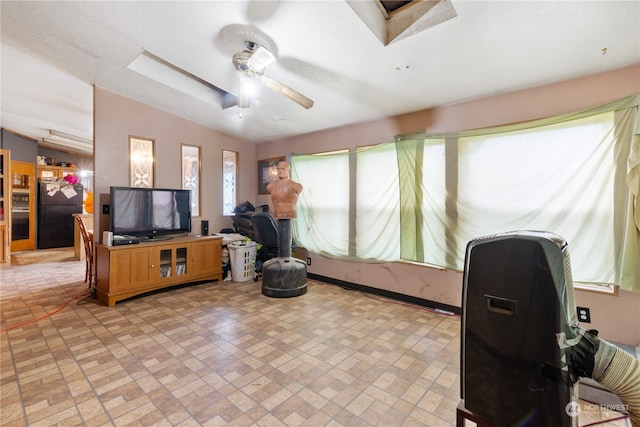 interior space with vaulted ceiling and ceiling fan