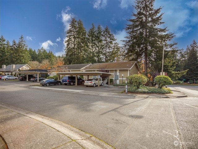 exterior space with a carport