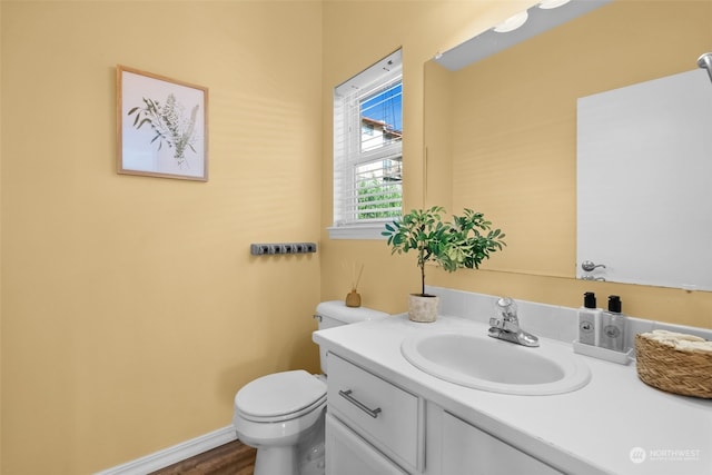 404 E 31st St, Bremerton, WA 98310 - bathroom with toilet, vanity, and hardwood / wood-style floors