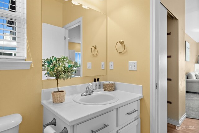 404 E 31st St, Bremerton, WA 98310 - bathroom featuring hardwood / wood-style floors, vanity, and toilet
