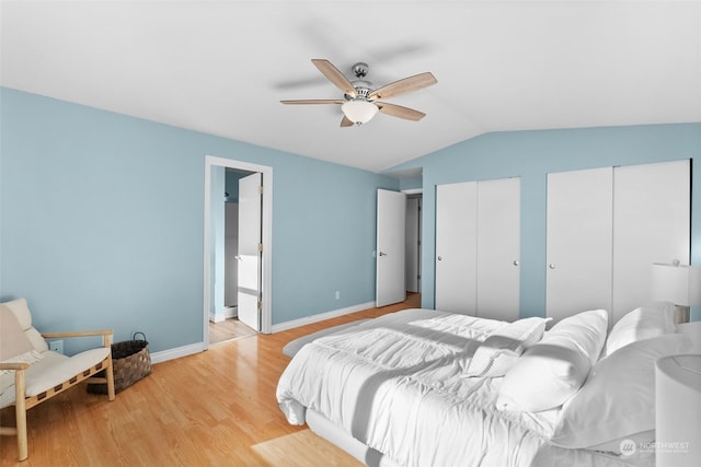 404 E 31st St, Bremerton, WA 98310 - bedroom with multiple closets, light hardwood / wood-style flooring, ceiling fan, and vaulted ceiling