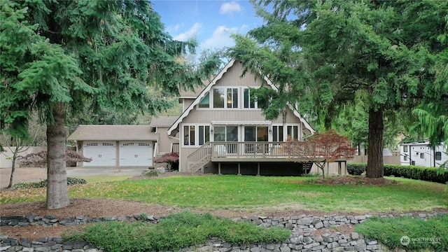 view of front facade with a front lawn, a deck, and a garage