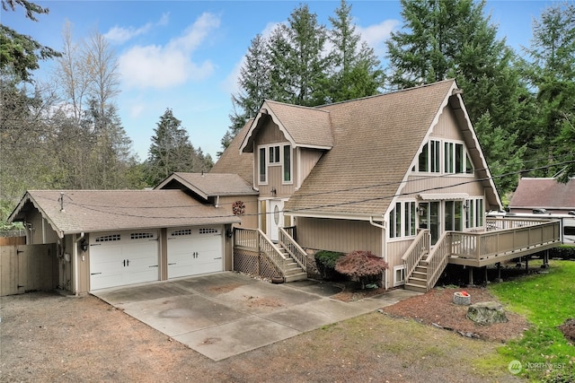 view of front of house with a garage and a wooden deck