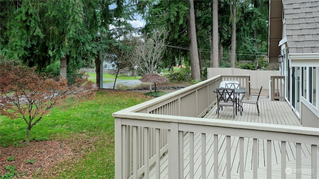 wooden terrace with a yard