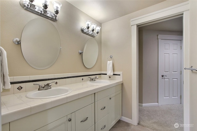 bathroom with tile patterned floors and vanity