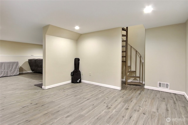 spare room featuring light hardwood / wood-style floors