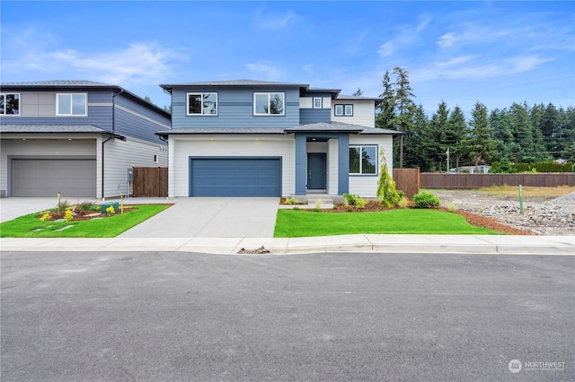 1621 137th St E Unit 19, Tacoma, WA 98445 - view of front facade with a garage and concrete driveway