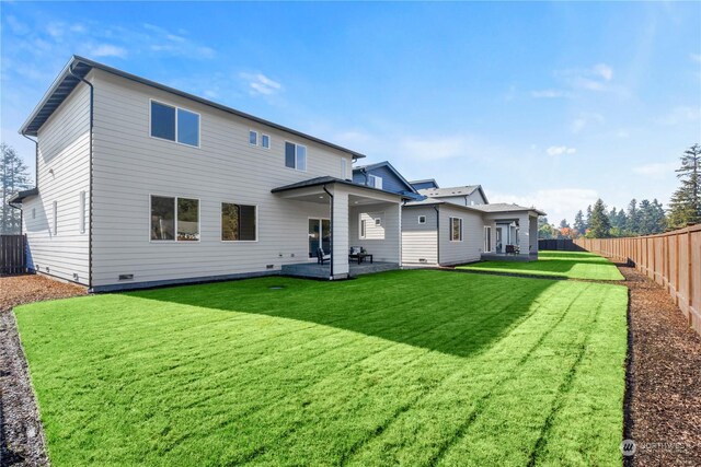 1621 137th St E Unit 19, Tacoma, WA 98445 - back of house with a patio area and a fenced backyard