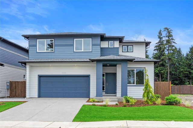 1621 137th St E Unit 19, Tacoma, WA 98445 - view of front of property with driveway and a garage