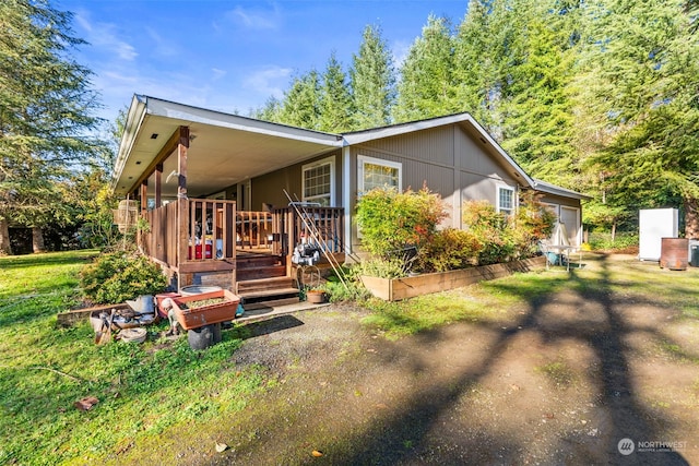 exterior space with a lawn and a wooden deck