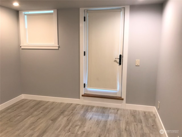 unfurnished room with light hardwood / wood-style flooring