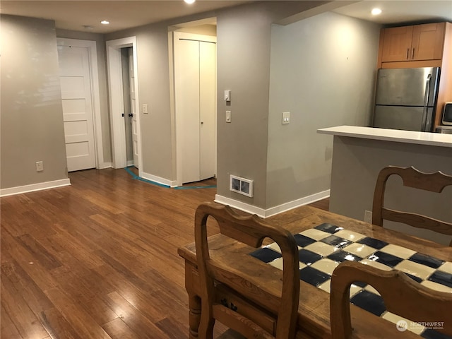 dining room featuring dark hardwood / wood-style flooring