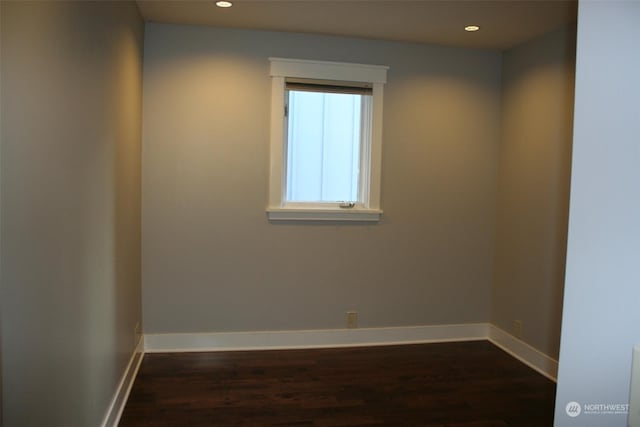 spare room featuring dark hardwood / wood-style floors