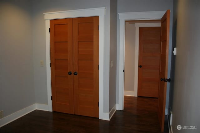 hall with dark hardwood / wood-style floors