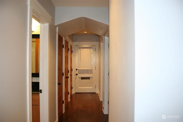 corridor with dark wood-type flooring