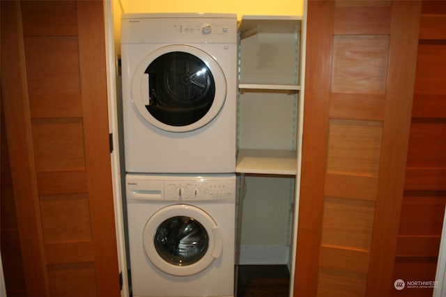 laundry room featuring stacked washing maching and dryer