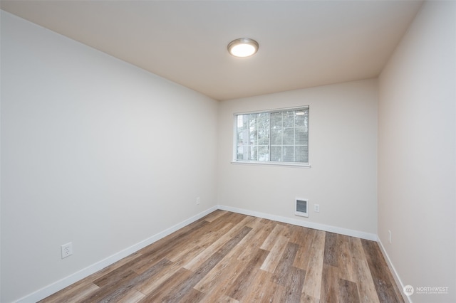 unfurnished room featuring light hardwood / wood-style floors