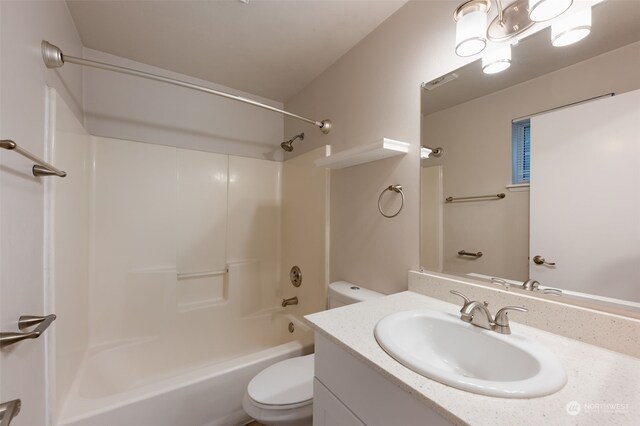 full bathroom with vanity, toilet, and shower / washtub combination