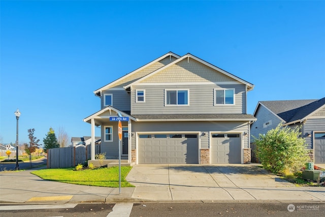 craftsman-style home with a garage