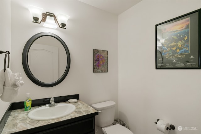 bathroom with vanity and toilet