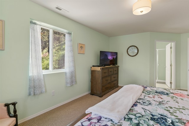 bedroom with light colored carpet