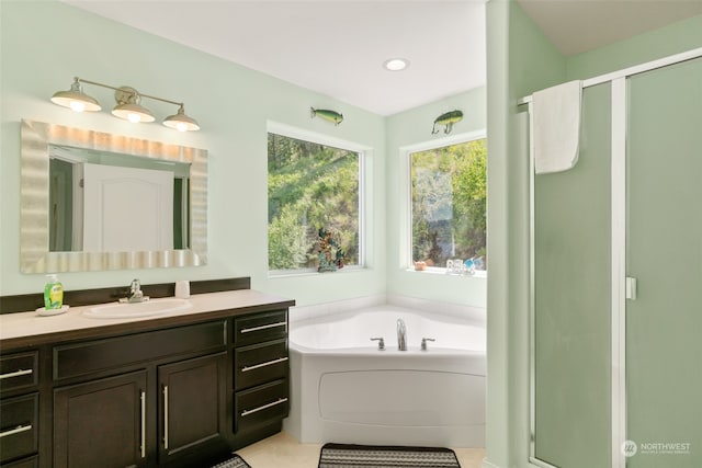 bathroom featuring vanity, separate shower and tub, and tile patterned floors